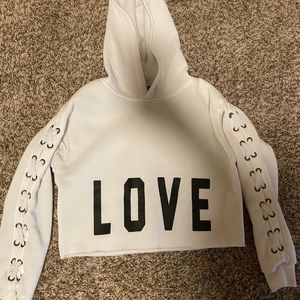 White cropped jacket with black lettering